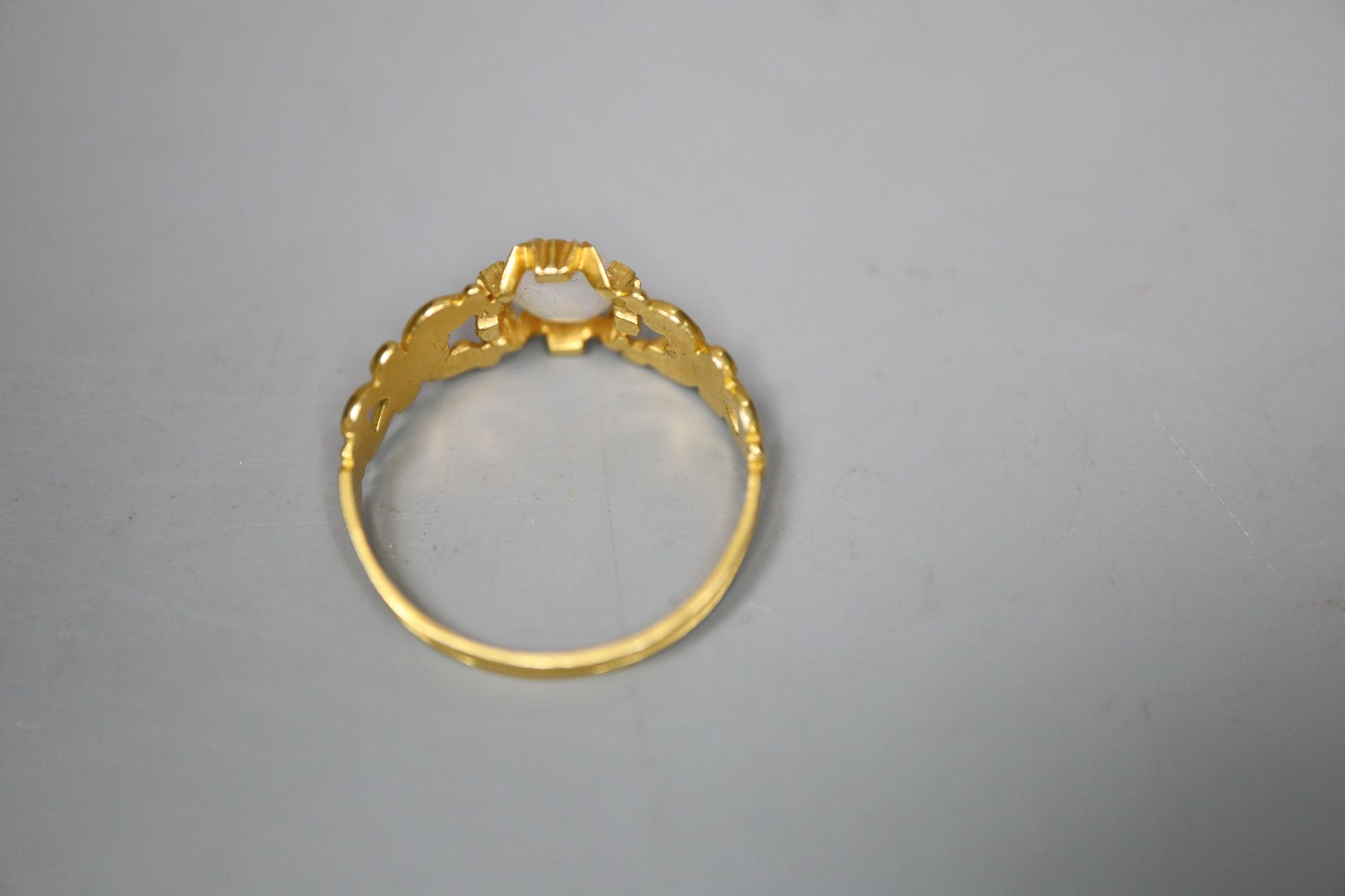 A Victorian gold and white opal dress ring, gross 2.2 grams